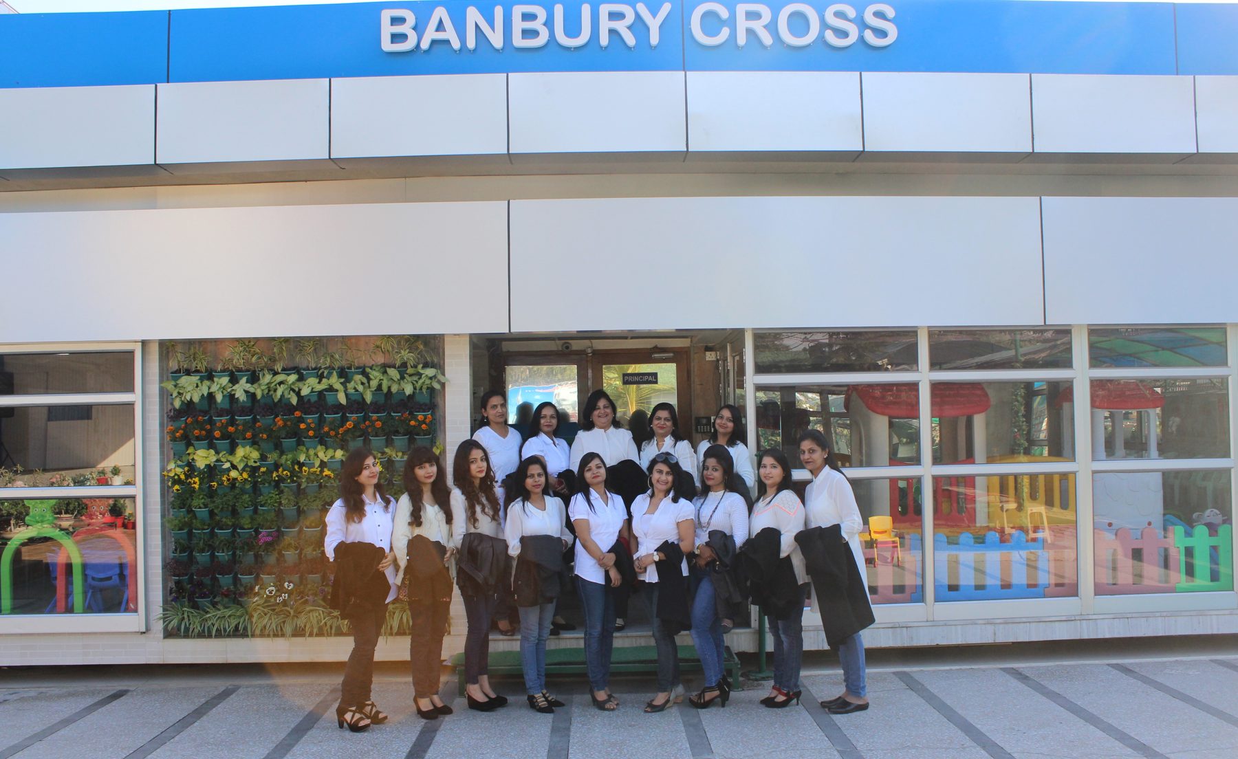 The teaching staff of Banbury Cross Educational Academy outside the school